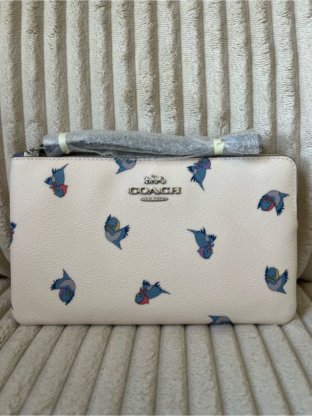 Coach Cream Wristlet with Blue and Pink Bird Print